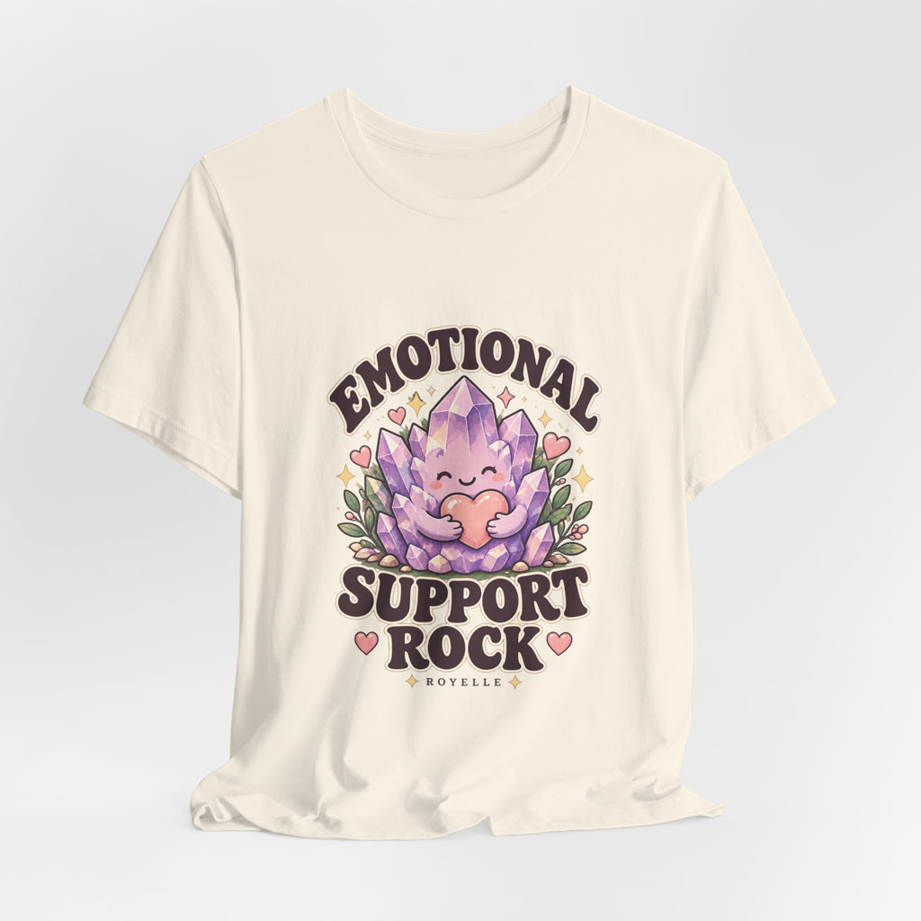 Royelle Emotional Support Rock T-shirt in Natural, hanging front view, with a smiling purple crystal hugging a pink heart and slogan.