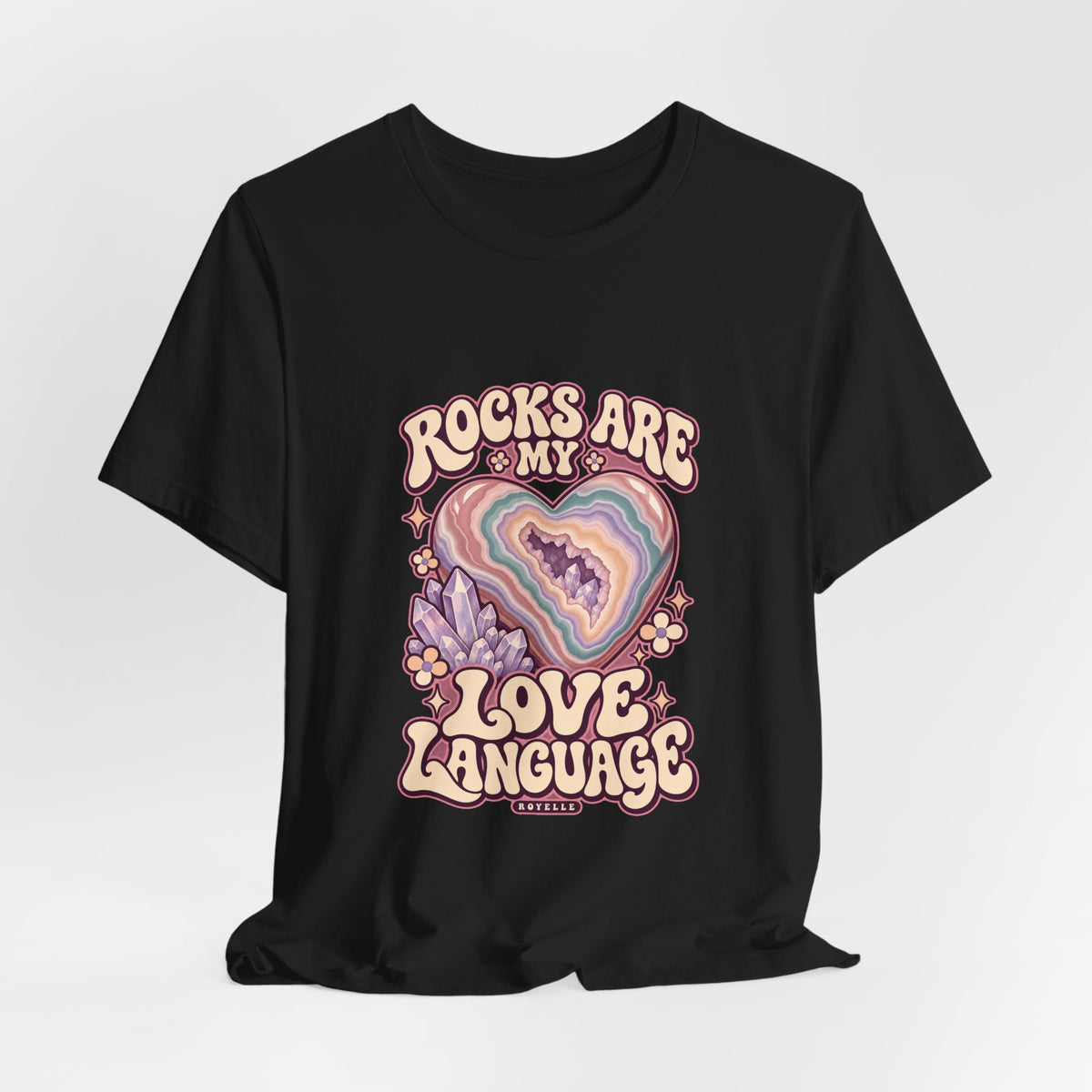 Royelle Rocks Are My Love Language T-shirt in Black, hanging front view, with pastel agate heart, crystals and flowers and slogan.