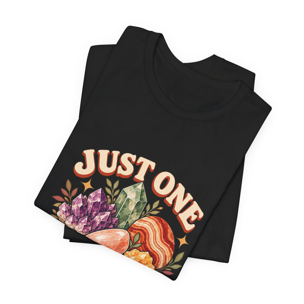 Royelle Just One More Rock T-shirt in Black, folded front view, with colorful illustrated minerals and slogan.