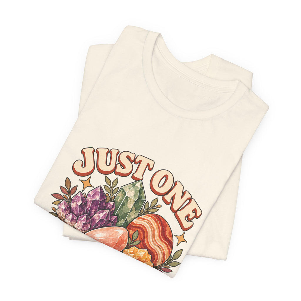 Royelle Just One More Rock T-shirt in Natural, folded front view, with colorful illustrated minerals and slogan.