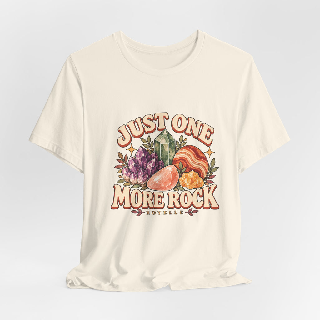 Royelle Just One More Rock T-shirt in Natural, hanging front view, with colorful illustrated minerals and slogan.