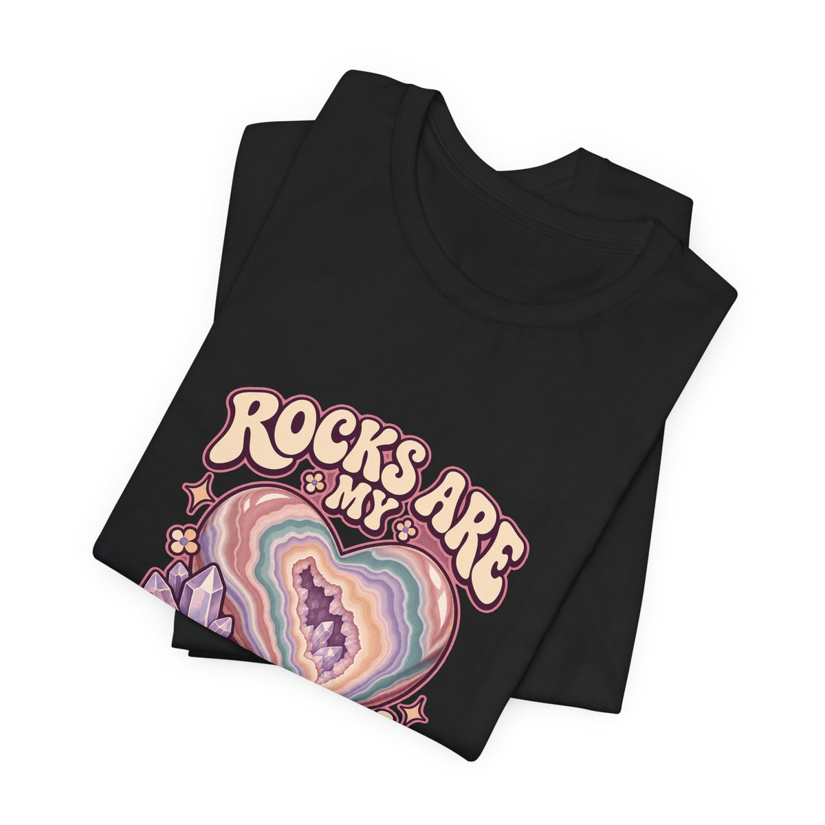 Royelle Rocks Are My Love Language T-shirt in Black, folded front view, with pastel agate heart, crystals and flowers and slogan.